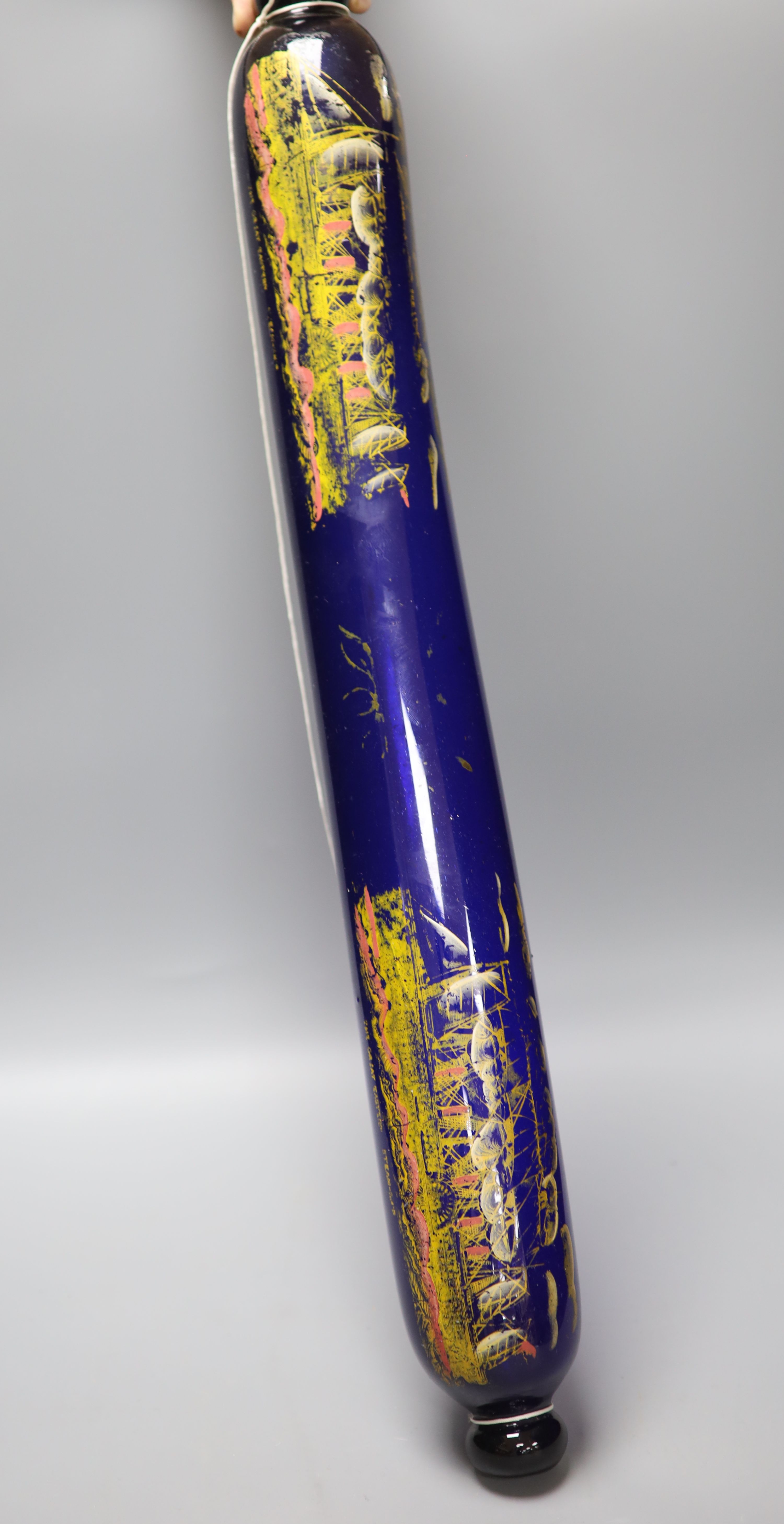 A large 9th century painted glass rolling pin, length 71cm
